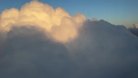 Flying Through Clouds at Sunset View From Airplane Window. Fluffy Clouds Bl.. Video stock 339295611