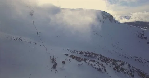 Flying Through Clouds Towards Snowy Mountain Stock Footage 60634246