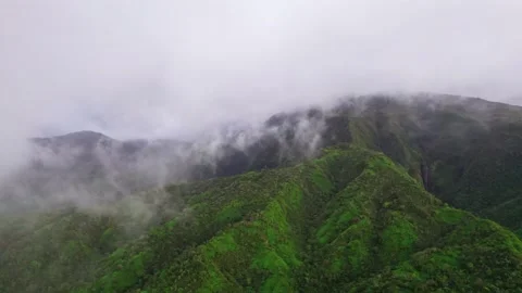 Flying through clouds on a tropical volcanic island. Aerial view of Tahiti. Stock Footage 166203928