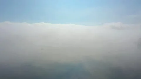 Flying through clouds with view on Alp mountain landscape Stock Footage 148844082