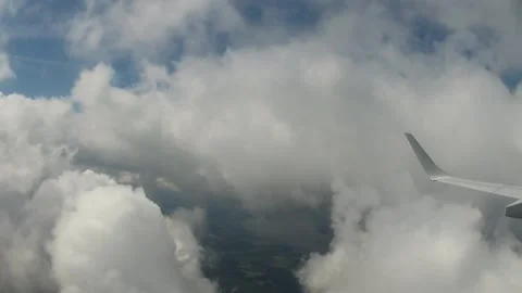 Flying through the clouds on a windy day over Europe. Stock Footage 147034056