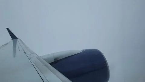 Flying through Clouds with Wing and Engine in View Stock Footage 220319068