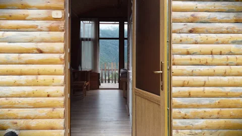 Flying through the cottage outside to the mountains covered in fog. Stock Footage 134304135