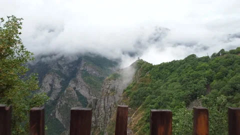 Flying through the cottage outside to the mountains covered in fog. Stock Footage 134308090