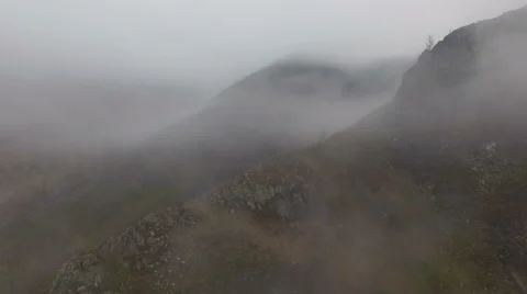 Flying through the dense fog in the mountains Stock Footage 67561978