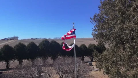 Flying Through a Flapping, Torn American Flag – Late 1800's Cemetery Scene, 4K Stock Footage 304472600