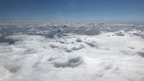 Flying through fluffy white clouds in the sky Stock Footage 98751183