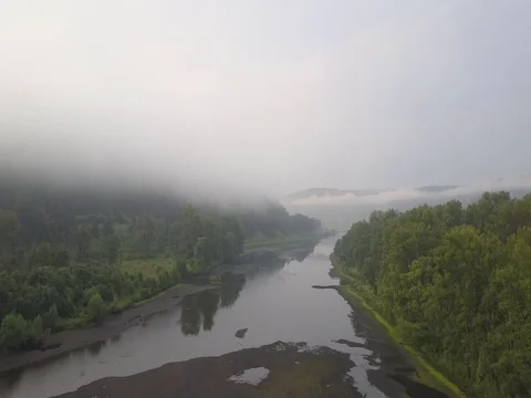 Flying through the fog over the river Stock Footage 78438292