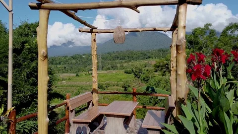 Flying through gazebo to expanse with a view of mountains and rice terraces Bali Stock Footage 126970102