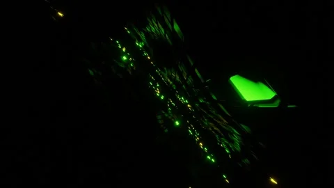 Flying through glowing rotating green and yellow flashing neon squares Stock Footage 165545873