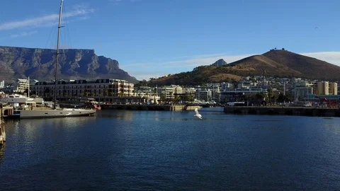 Flying Through A Harbor With Mountains On Background [Drone Footage] Stock Footage 90934460