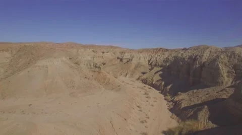 Flying through hills in a desert Stock Footage 58014840