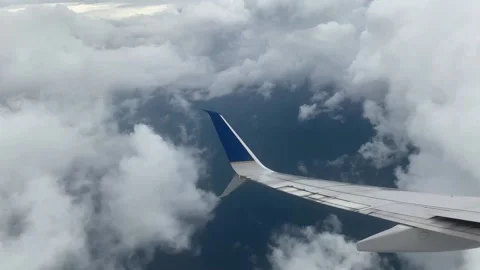 Flying Through Huge Dramatic Clouds Passenger POV Stock Footage 228426340