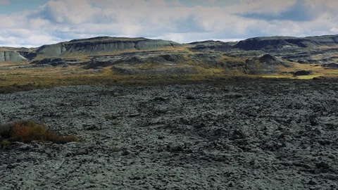 Flying through the Icelandic epic Lava field moss-covered landscape. Stock Footage 116243865