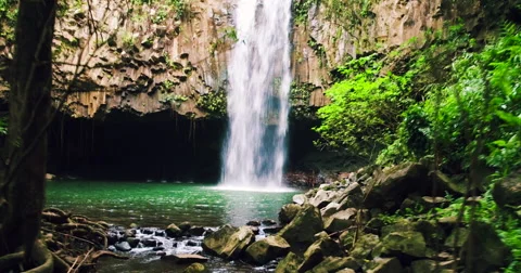Flying Through Jungle Towards Waterfall. 4K Aerial View Through Tropical Jung Stockbeeldmateriaal 56876233