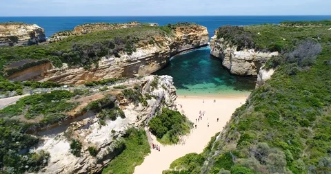 Flying through Loch Ard Gorge Beach, Great Ocean Road, 12 Apostels, Australia Stock Footage 98350977