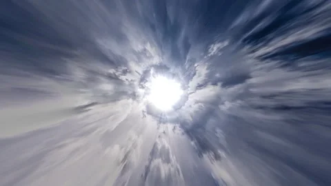 Flying through looping cloudy wormhole towards a bright light. Stock Footage 258328361