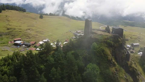 Flying through low clouds to the ruins of monastery on the hill Stock Footage 228737368