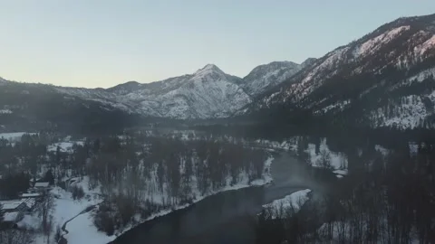 Flying Through Low-Level Clouds Toward Snowy Mountains 스톡 동영상 187787949