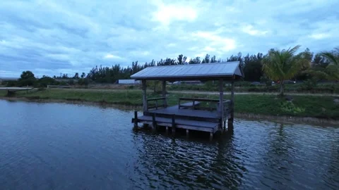 Flying through mini dock surrounded by water cinematic 4k Stock Footage 292742730