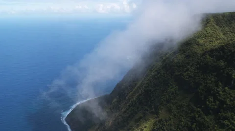Flying through mist along Molokai's coastal cliffs. Shot in 2010. Stock Footage 59523468