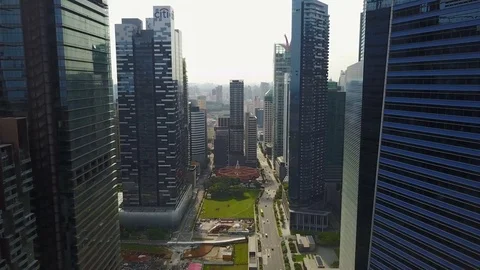 Flying through modern skyscraper offices in Singapore Stock Footage