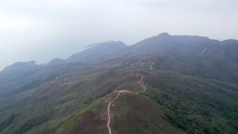Flying through the mountains in the Ling Wui Shan, Lantau Island, Hong Kong Video stock 195281481