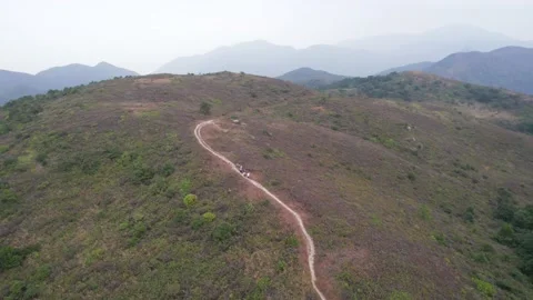 Flying through the mountains in the Ling Wui Shan, Lantau Island, Hong Kong Video stock 195281530