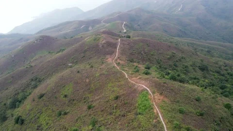 Flying through the mountains in the Ling Wui Shan, Lantau Island, Hong Kong Video stock 195281593