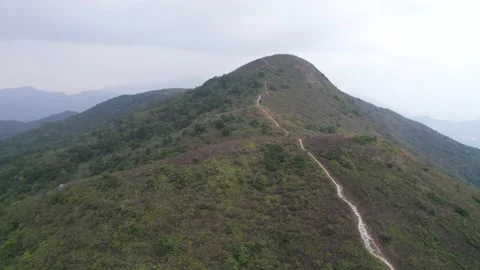 Flying through the mountains in the Ling Wui Shan, Lantau Island, Hong Kong Video stock 195281612