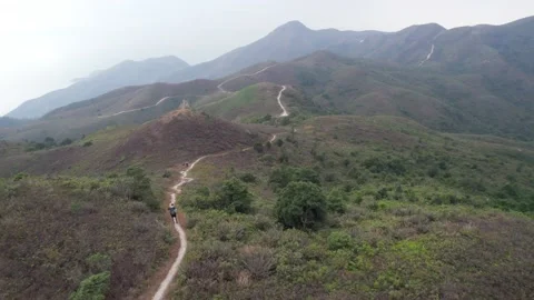 Flying through the mountains in the Ling Wui Shan, Lantau Island, Hong Kong Video stock 195281631