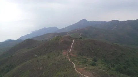 Flying through the mountains in the Ling Wui Shan, Lantau Island, Hong Kong Video stock 195281633