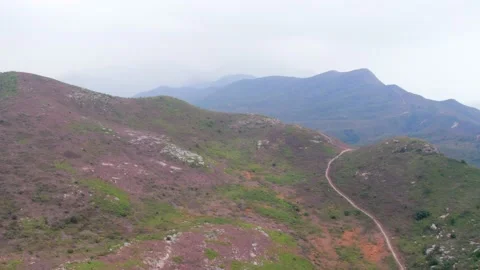 Flying through the mountains in the Ling Wui Shan, Lantau Island, Hong Kong Video stock 195281635