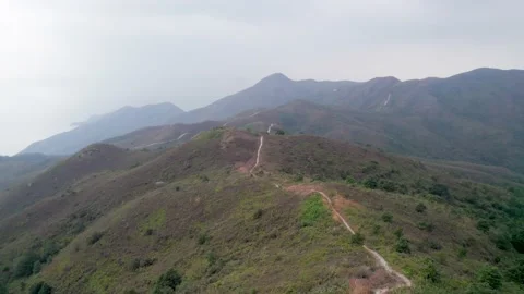 Flying through the mountains in the Ling Wui Shan, Lantau Island, Hong Kong Video stock 195281642