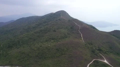 Flying through the mountains in the Ling Wui Shan, Lantau Island, Hong Kong Video stock 195281653