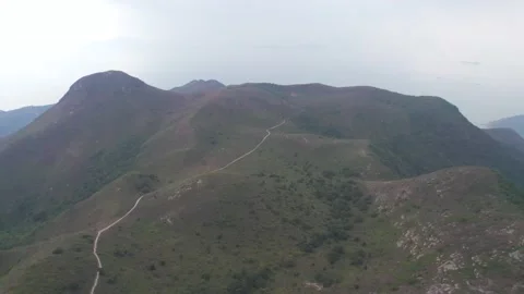 Flying through the mountains in the Ling Wui Shan, Lantau Island, Hong Kong Video stock 195281660