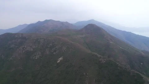 Flying through the mountains in the Ling Wui Shan, Lantau Island, Hong Kong Video stock 195281663