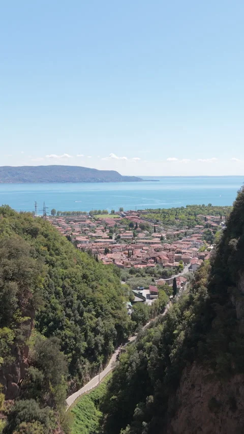 Flying Through Narrow Mountain Gorge, Steep Cliffs, Vertical Drone Shot Stock Footage 343684470