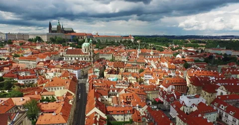 Flying through the old town of Prague, Czech Republic on a sunny day with clouds Stock Footage 61085771