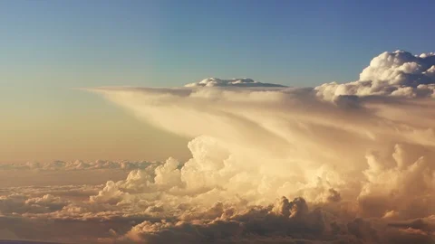 Flying through picturesque evening clouds softly lit by the sun Video stock 92163841