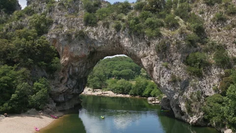 Flying through Pont d'arc natural arch river ardeche, France Stock Footage 260186124