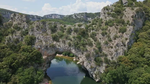 Flying through Pont d'arc natural arch river ardeche, France Stock Footage 260192908