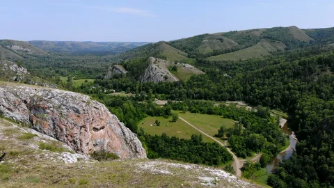 Flying through the rocks, green nature. beautiful frame. Stock Footage 129509447