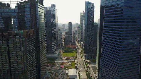 Flying through Singapore financial and business district Stock Footage
