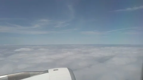 Flying through sky from airplane window Stockbeeldmateriaal 201307150