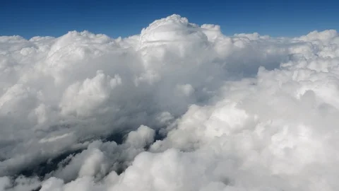 Flying Through a Sky Full of Cumulus Clo... | Stock Video | Pond5