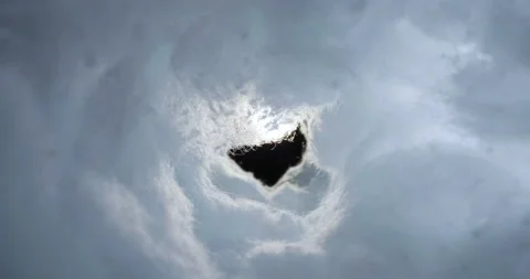 Flying through sky tunnel of puffy white cumulus storm clouds Stock Footage 154211084