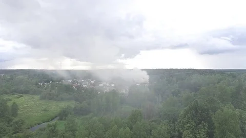 Flying through the smoke of the fire in the village. Aerial view. 스톡 동영상 74856659