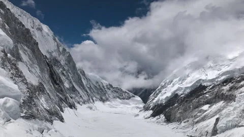 Flying through a snowy mountain valley in the Himalayas Stock-Footage 335495022