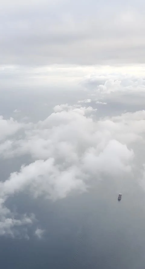 Flying through soft clouds over the sea, created for social media ads Stock Footage 243772681